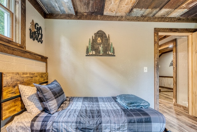 bedroom with wood finished floors