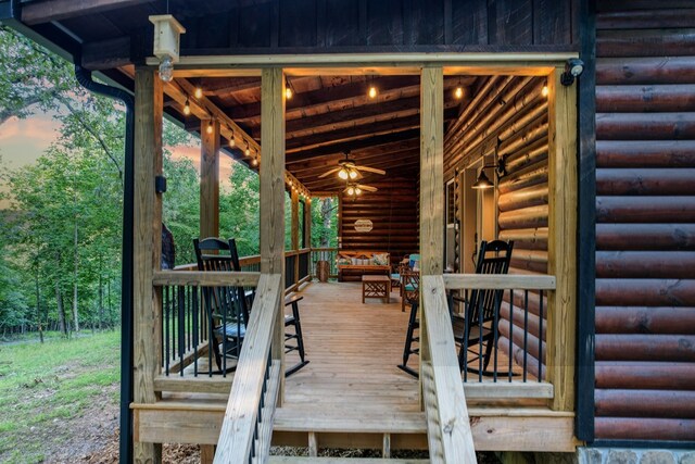 wooden terrace with a ceiling fan