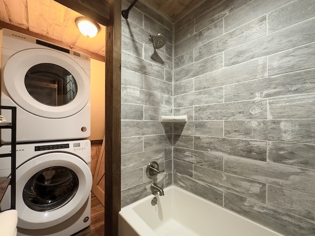 washroom featuring laundry area and stacked washer and dryer