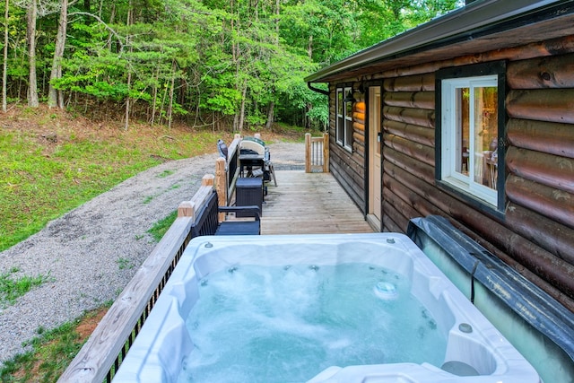 view of patio with a wooden deck, area for grilling, and an outdoor hot tub