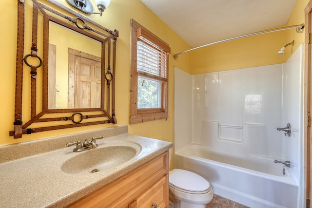 bathroom with shower / washtub combination, toilet, and vanity