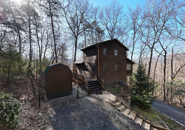 view of side of home with an outbuilding