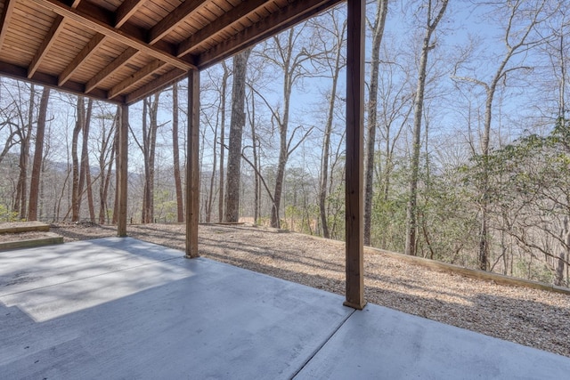 view of patio / terrace with a view of trees