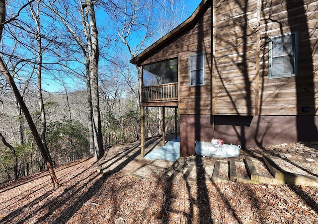 view of property exterior featuring a balcony