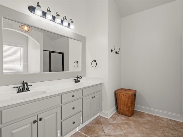 bathroom featuring tile patterned floors, vanity, and an enclosed shower