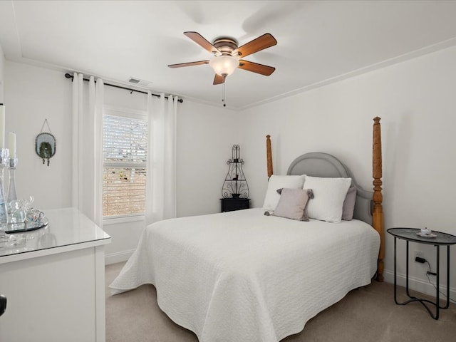 bedroom with light carpet and ceiling fan