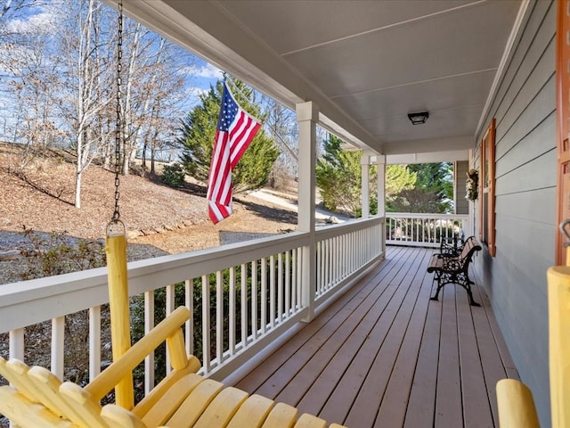 wooden terrace with a porch