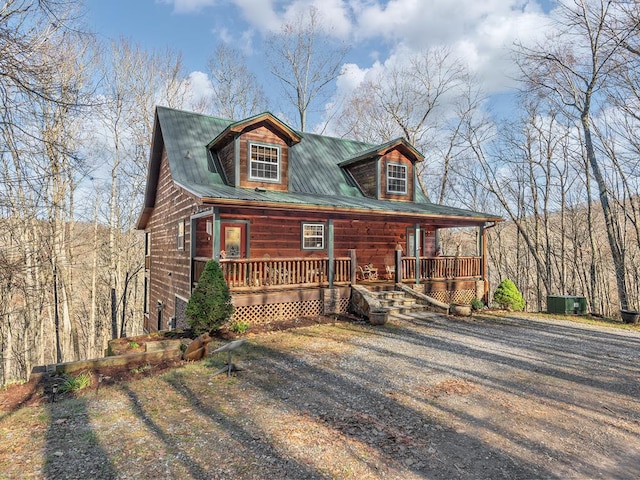 log cabin with a porch