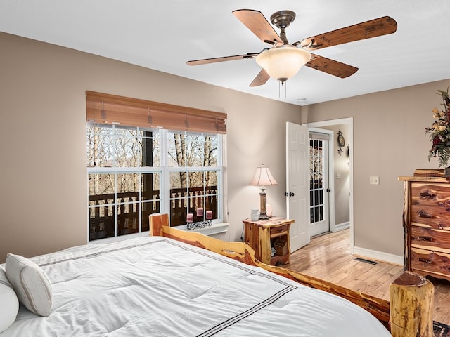 bedroom featuring ceiling fan and light hardwood / wood-style flooring