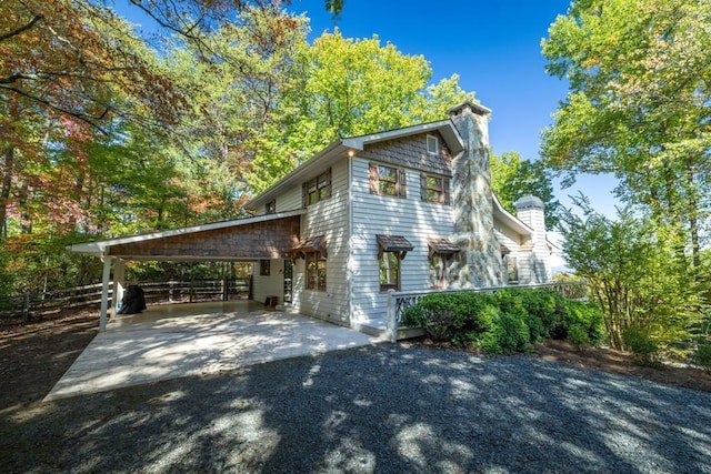 view of property exterior with a carport