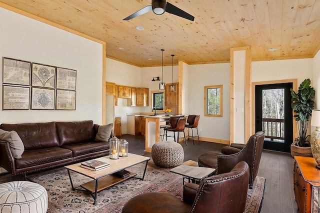 living area featuring baseboards, wooden ceiling, ceiling fan, wood finished floors, and high vaulted ceiling