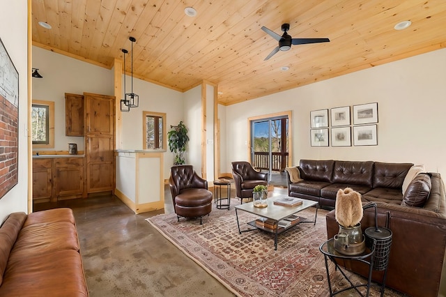 living room featuring crown molding, lofted ceiling, finished concrete floors, wood ceiling, and ceiling fan