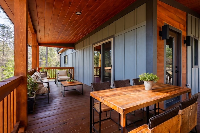 wooden deck with outdoor dining space