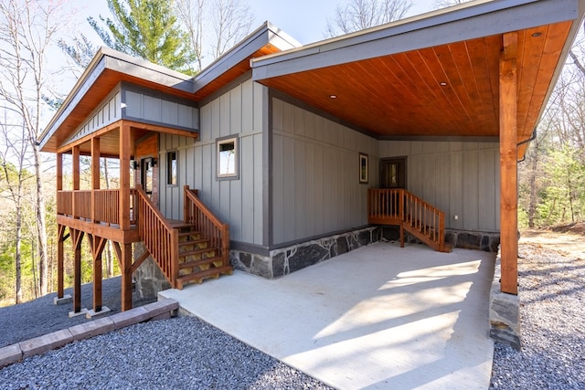 view of exterior entry featuring board and batten siding