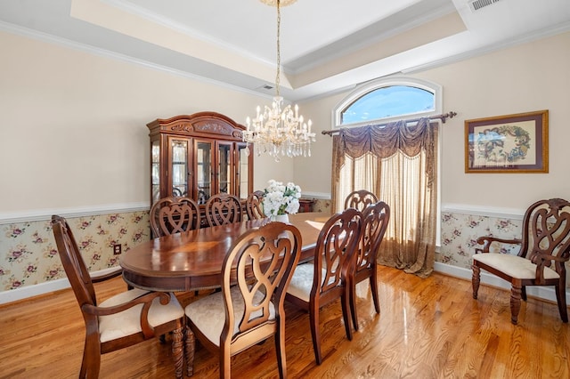 226 Euharlee Five Forks Rd, Kingston, GA 30145 - dining room with a tray ceiling, a chandelier, light wood-style flooring, wallpapered walls, and ornamental molding