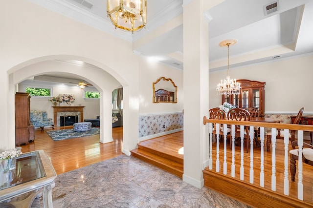 226 Euharlee Five Forks Rd, Kingston, GA 30145 - hallway featuring a chandelier, crown molding, arched walkways, and baseboards