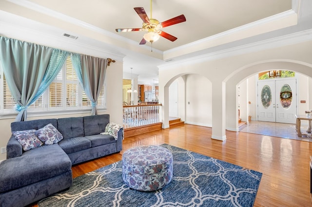 226 Euharlee Five Forks Rd, Kingston, GA 30145 - living room with arched walkways, wood finished floors, a ceiling fan, crown molding, and baseboards