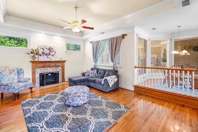 226 Euharlee Five Forks Rd, Kingston, GA 30145 - living area with a premium fireplace, ceiling fan, healthy amount of natural light, wood finished floors, and ornamental molding