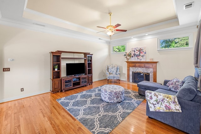 226 Euharlee Five Forks Rd, Kingston, GA 30145 - living area featuring a raised ceiling, a ceiling fan, a high end fireplace, wood finished floors, and ornamental molding