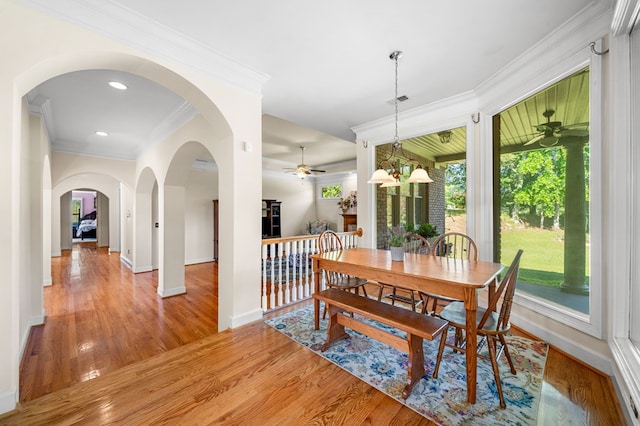 226 Euharlee Five Forks Rd, Kingston, GA 30145 - dining space featuring ceiling fan, crown molding, light wood-style floors, baseboards, and arched walkways