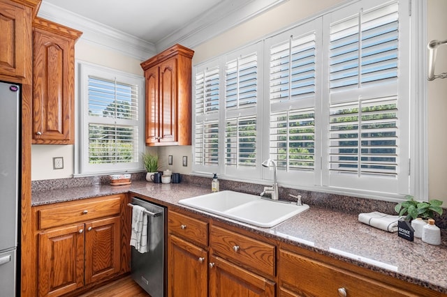 226 Euharlee Five Forks Rd, Kingston, GA 30145 - kitchen with stainless steel appliances, a sink, brown cabinets, ornamental molding, and dark countertops