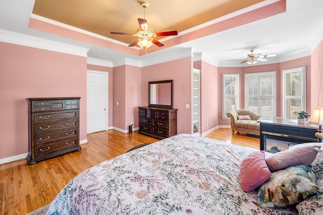226 Euharlee Five Forks Rd, Kingston, GA 30145 - bedroom with wood finished floors, baseboards, crown molding, a raised ceiling, and a ceiling fan