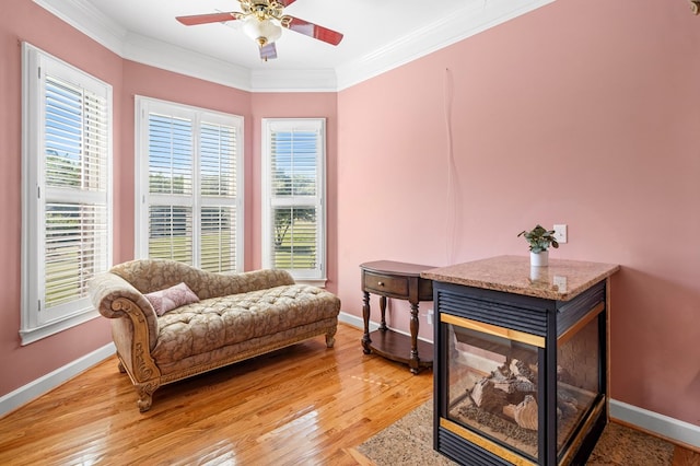 226 Euharlee Five Forks Rd, Kingston, GA 30145 - living area with crown molding, ceiling fan, baseboards, healthy amount of natural light, and light wood-style floors
