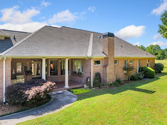 226 Euharlee Five Forks Rd, Kingston, GA 30145 - back of house with a shingled roof, ceiling fan, and a lawn