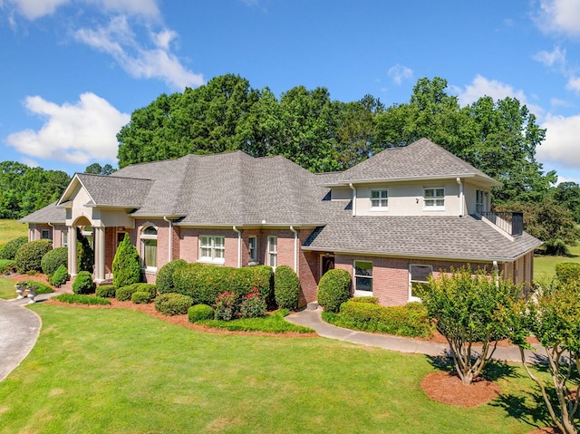 226 Euharlee Five Forks Rd, Kingston, GA 30145 - view of front facade with a front yard, roof with shingles, and brick siding