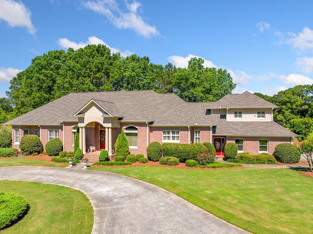 226 Euharlee Five Forks Rd, Kingston, GA 30145 - view of front of home with brick siding, a front yard, and a shingled roof