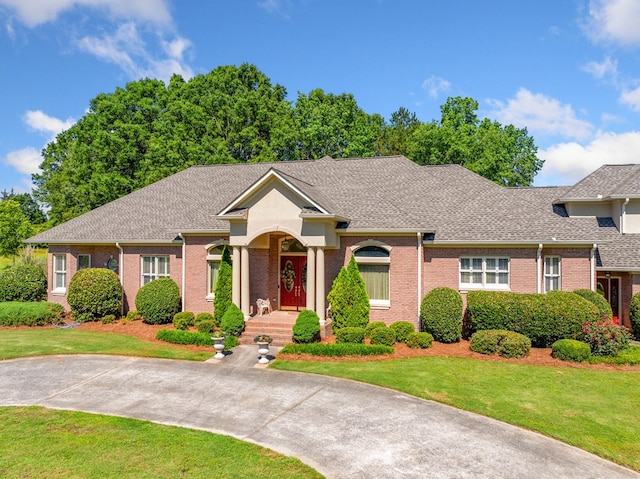 226 Euharlee Five Forks Rd, Kingston, GA 30145 - ranch-style home featuring brick siding, a front yard, and a shingled roof