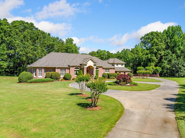 226 Euharlee Five Forks Rd, Kingston, GA 30145 - view of front of home with curved driveway, a front lawn, and view of wooded area