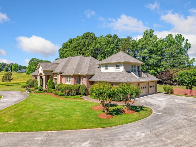 226 Euharlee Five Forks Rd, Kingston, GA 30145 - view of front facade featuring curved driveway, an attached garage, and brick siding