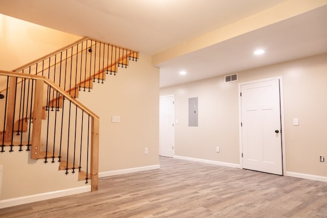 61 Morningside Ct, Ellijay, GA 30540 - unfurnished living room with electric panel, wood finished floors, recessed lighting, and stairway