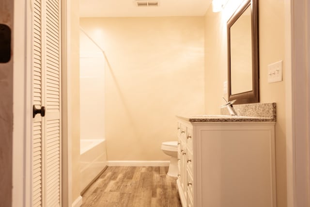 61 Morningside Ct, Ellijay, GA 30540 - bathroom featuring a closet, vanity, wood finished floors, and washtub / shower combination