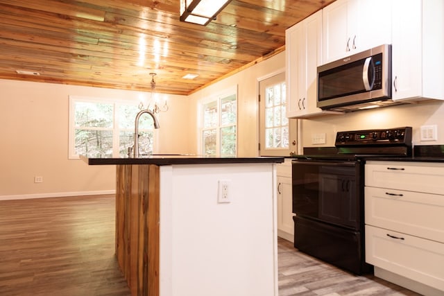 61 Morningside Ct, Ellijay, GA 30540 - kitchen featuring stainless steel microwave, black electric range, wooden ceiling, dark countertops, and white cabinetry
