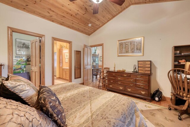 bedroom with ceiling fan, high vaulted ceiling, light hardwood / wood-style floors, and wooden ceiling