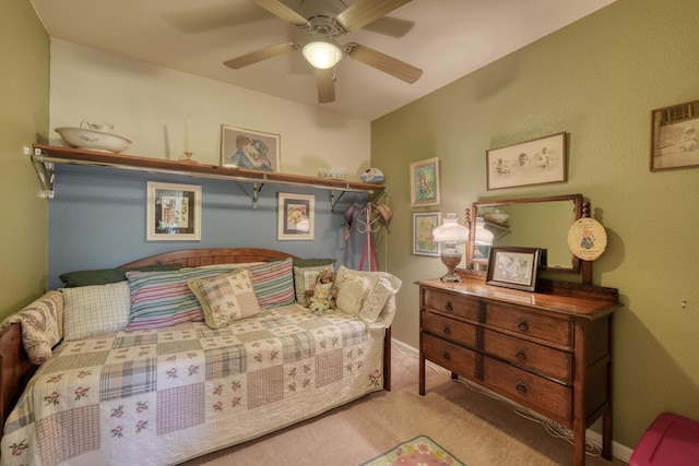 bedroom with ceiling fan and light colored carpet