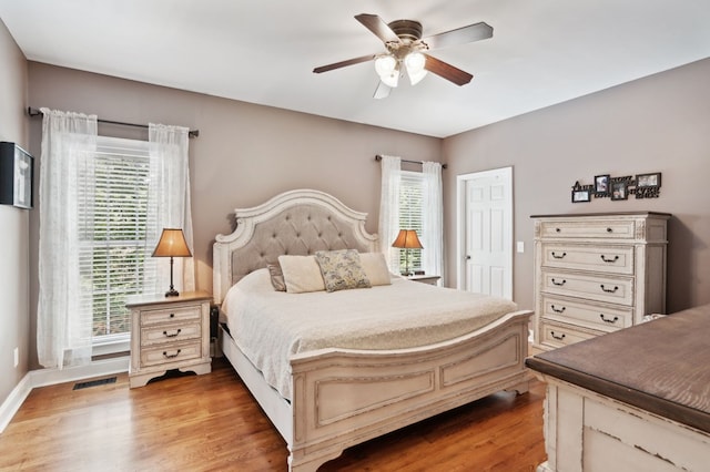 bedroom featuring ceiling fan and light hardwood / wood-style flooring