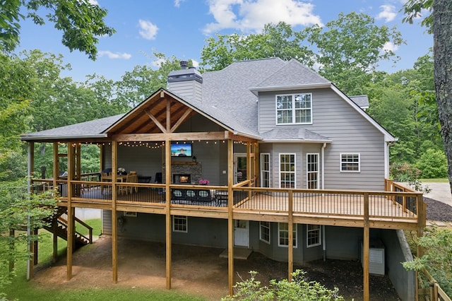 back of property featuring a wooden deck