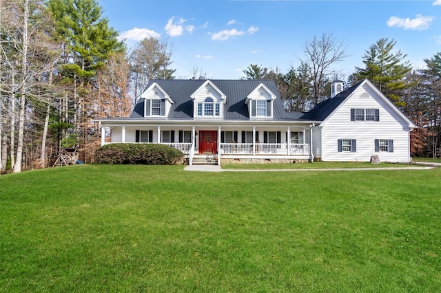 cape cod-style house featuring covered porch and a front yard