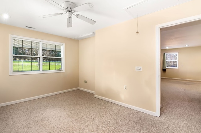 spare room with ceiling fan and carpet floors