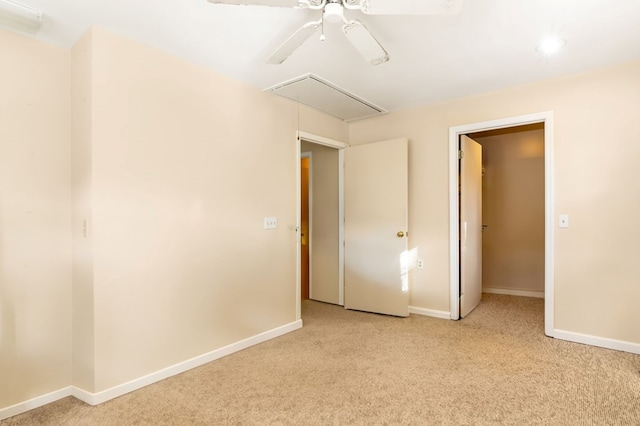 unfurnished bedroom with ceiling fan, a closet, and light colored carpet