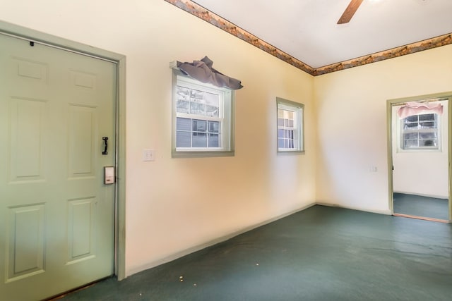 foyer featuring ceiling fan