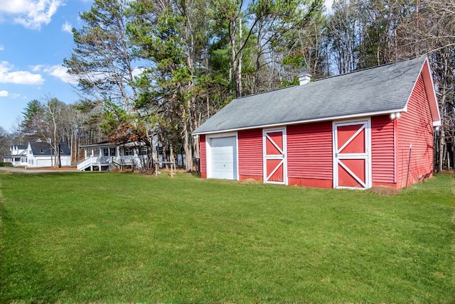 view of outdoor structure featuring a yard