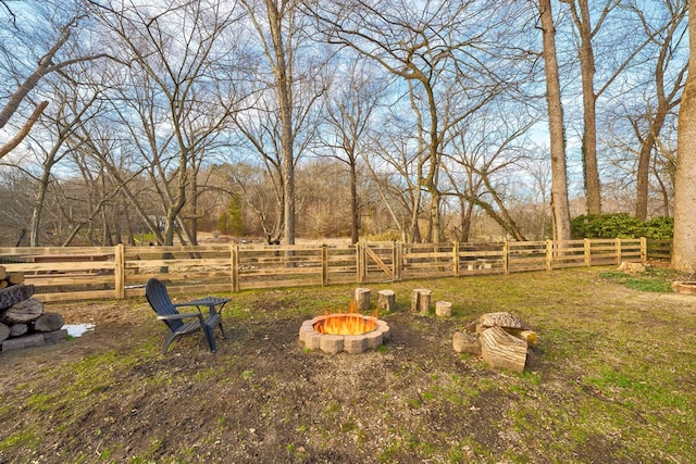 view of yard featuring an outdoor fire pit