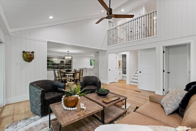 1220 Walnut Rdg, Ellijay, GA 30536 - living room with light wood finished floors, ceiling fan, stairs, a towering ceiling, and recessed lighting