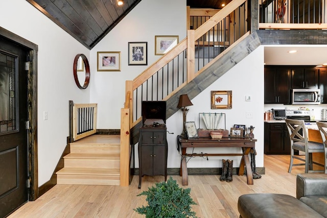 681 Confederate Cir, Murphy, NC 28906 - stairway with baseboards, high vaulted ceiling, wood finished floors, and wooden ceiling
