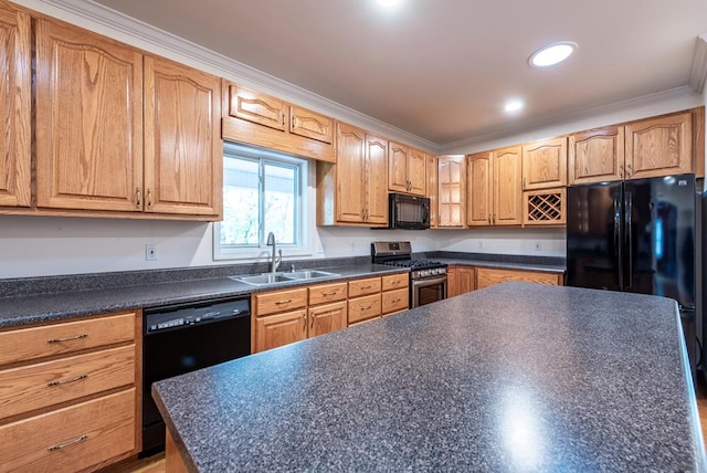 kitchen featuring a kitchen island, sink, black appliances, and crown molding