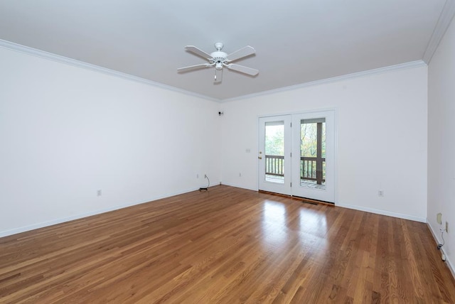 unfurnished room with hardwood / wood-style floors, ceiling fan, and crown molding